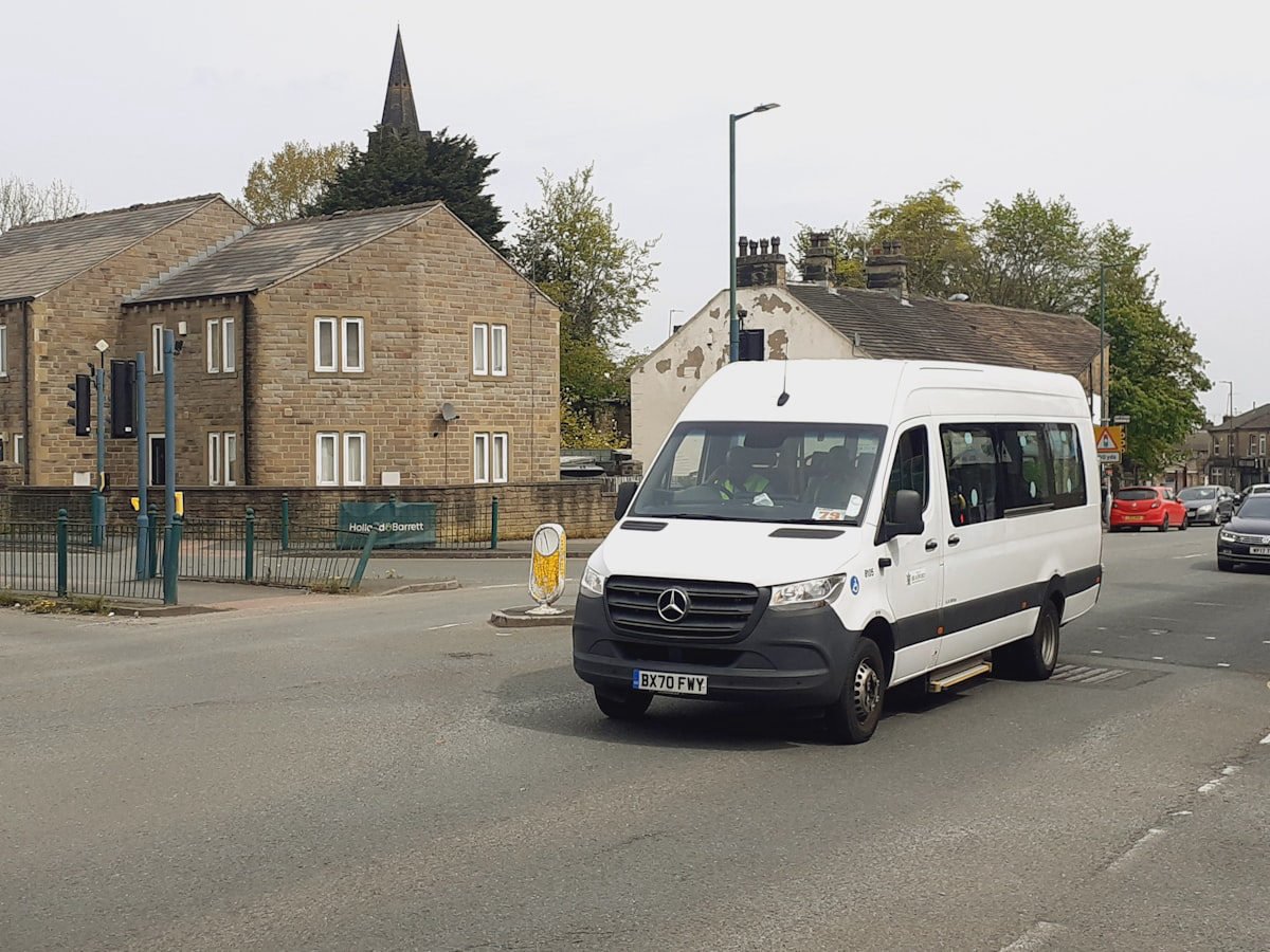 Van arriving on a city street at the end of the trip